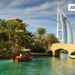 a view of a river with Burj al Arab in the background.